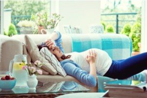 Pregnant Woman Sleeping on Couch